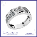A platinum band ring featuring a princess-cut diamond center stone and textured pavé-set side stones, shown on a white background with the Platizem brand logo at the bottom.