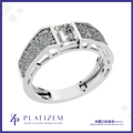 A silver-toned ring featuring a rectangular clear gemstone in a bezel setting, flanked by textured pavé-style inlays on a white background with the Platizem brand logo at the bottom.
