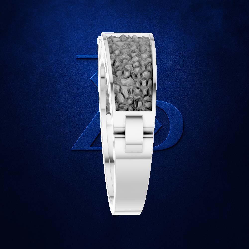 A silver-toned ring with a textured gray inlay, shown on a dark blue textured background with a subtle blue geometric logo behind it.
