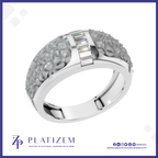 A silver-toned ring with a textured, flower-like pavé setting on the band and a central channel of baguette-cut clear stones, shown on a white background with the Platizem brand logo at the bottom.