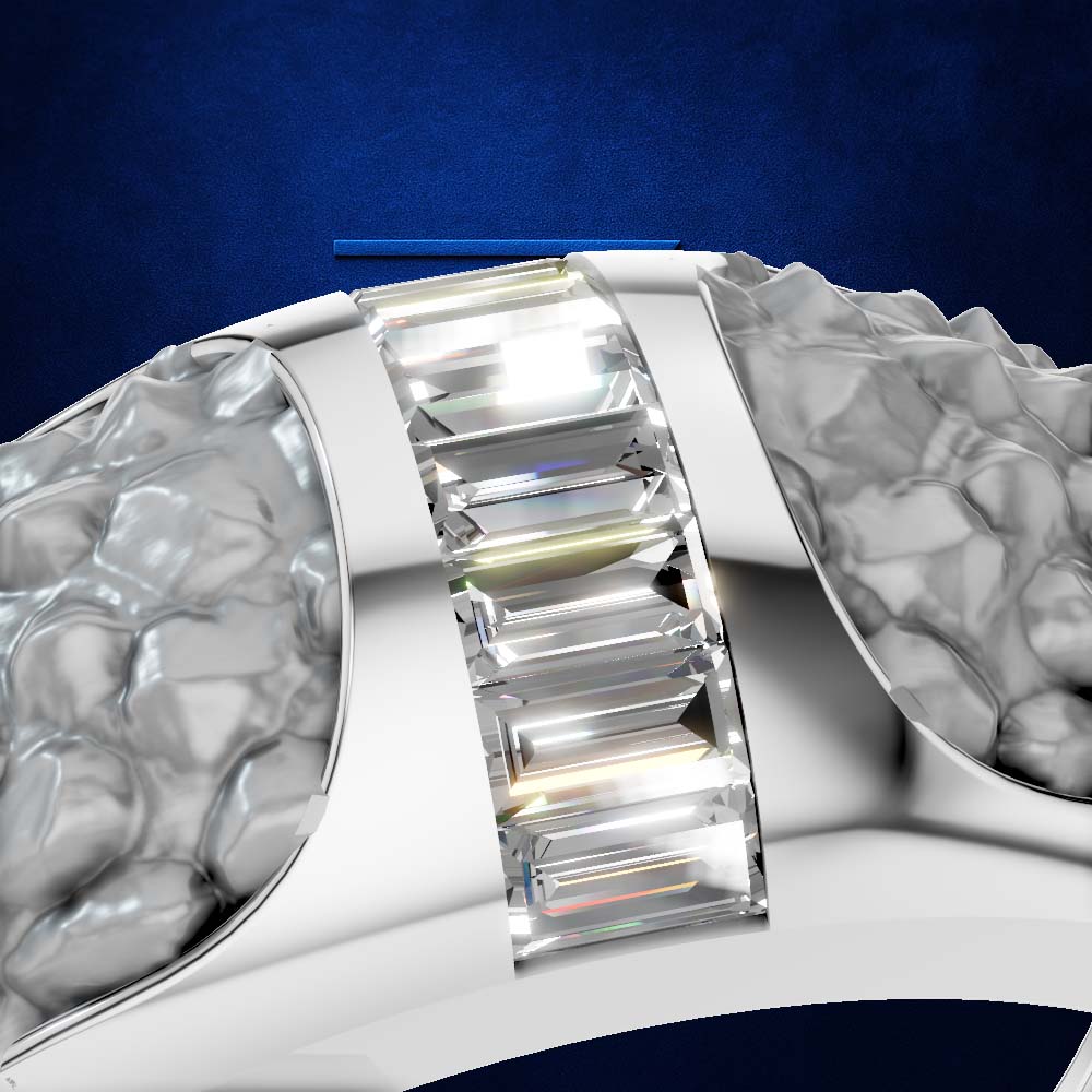 A close-up of a silver-toned ring featuring a central channel set with multiple baguette-cut clear stones, flanked by textured, hammered silver sides, set against a dark blue background.