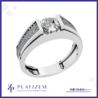 A platinum engagement ring featuring a round brilliant-cut center stone and pavé-set side stones, presented on a white background with the Platizem brand logo at the bottom.