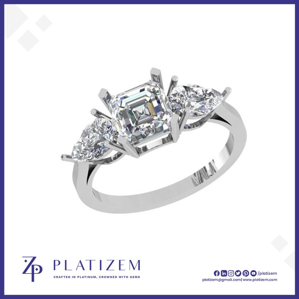 Emerald and Pear Three Stone Diamond Ring