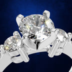 Round Diamond Three Stone Ring with a Graduated Pave Set Diamond Band