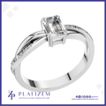 Emerald Cut Diamond Ring with Baguette Accents on a Gently Twisted Band