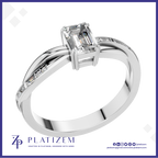 Emerald Cut Diamond Ring with Baguette Accents on a Gently Twisted Band
