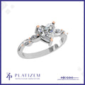Heart Cut Diamond Ring with Marquise Diamonds on a Curved Twist Band