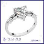 Heart Cut Diamond Ring with Marquise Diamonds on a Curved Twist Band