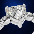 Heart Cut Diamond Ring with Marquise Diamonds on a Curved Twist Band