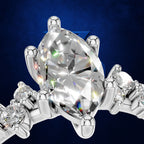 Marquise Diamond Ring with a Graduated Cluster of Round Diamonds