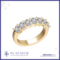 A yellow gold five-stone diamond ring with round-cut clear diamonds set in a classic prong setting, displayed on a white background with the brand logo 'PLATIZEM' at the bottom.
