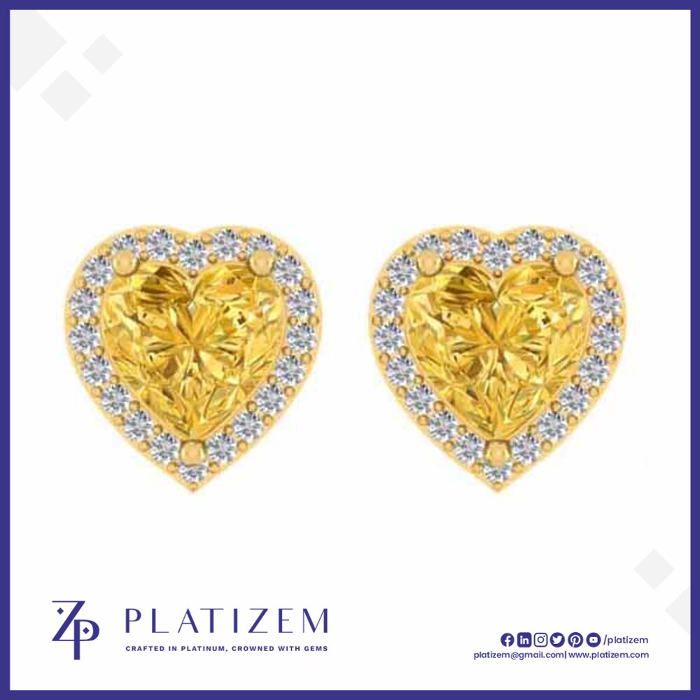 A pair of heart-shaped yellow diamond stud earrings with diamond halo borders, displayed on a white background with the brand logo 'PLATIZEM' at the bottom.